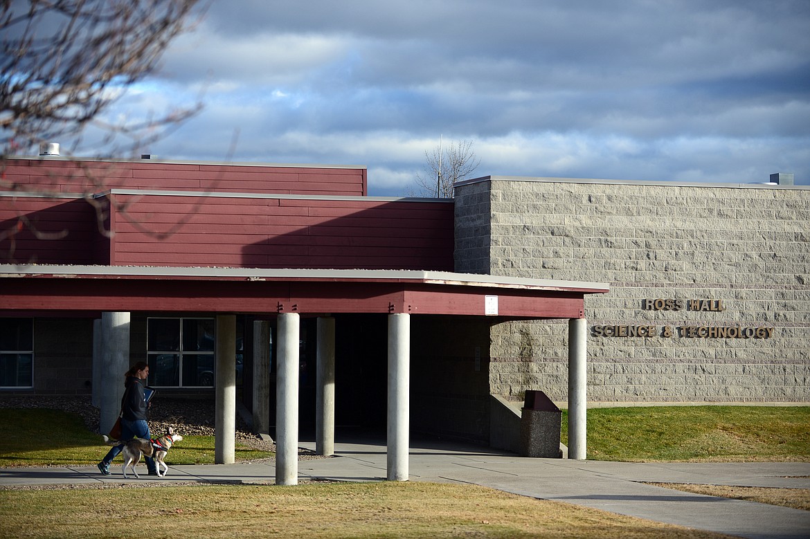 A student walks by the Ross Hall Science & Technology building at Flathead Valley Community College in Kalispell on Wednesday, Nov. 29. (Casey Kreider/Daily Inter Lake)