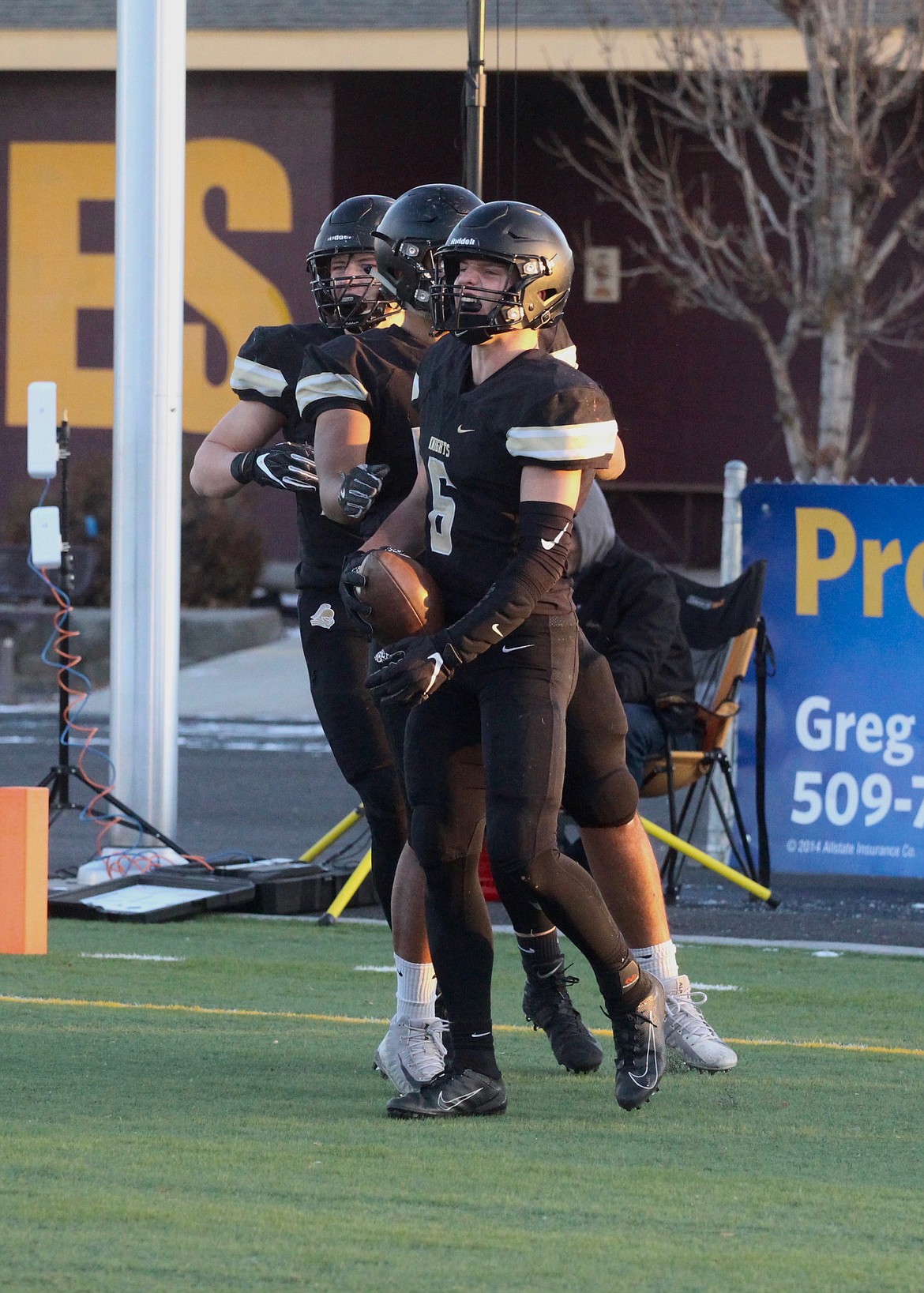 Casey McCarthy/Columbia Basin Herald Derek Bergeson celebrates with his teammates in the end zone after taking the interception in for the score in the first half on Saturday.