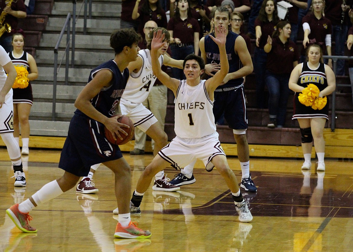 Casey McCarthy/Columbia Basin Herald Moses Lake’s Dylan Roylance plays defense at the top of the key in the first half against Mt. Spokane on Tuesday.