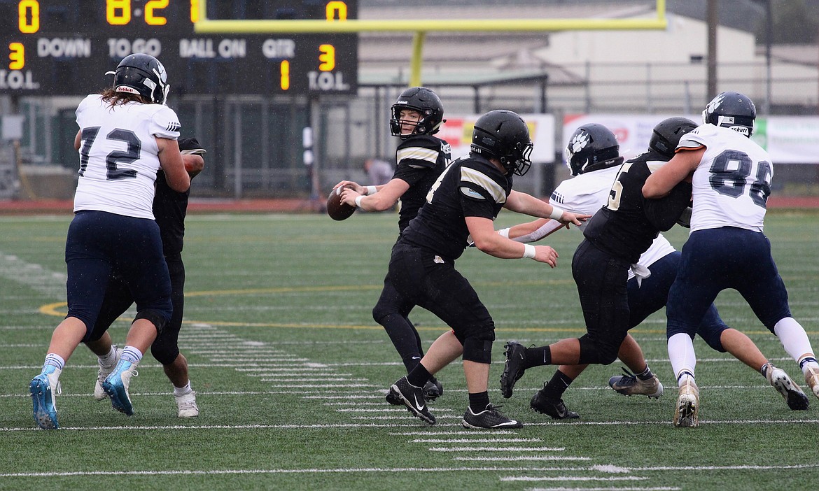 Casey McCarthy/Columbia Basin Herald Caleb Christensen steps back to pass during the first half of the 1A State Championship on Saturday afternoon.