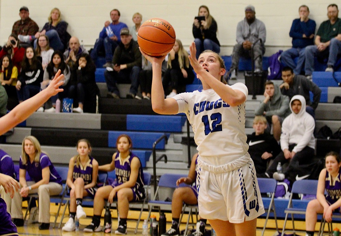 Casey McCarthy/Columbia Basin Herald Brecka Erdmann takes the shot in the fist half for the Cougars in the 61-19 win over Columbia(Burbank) at home.