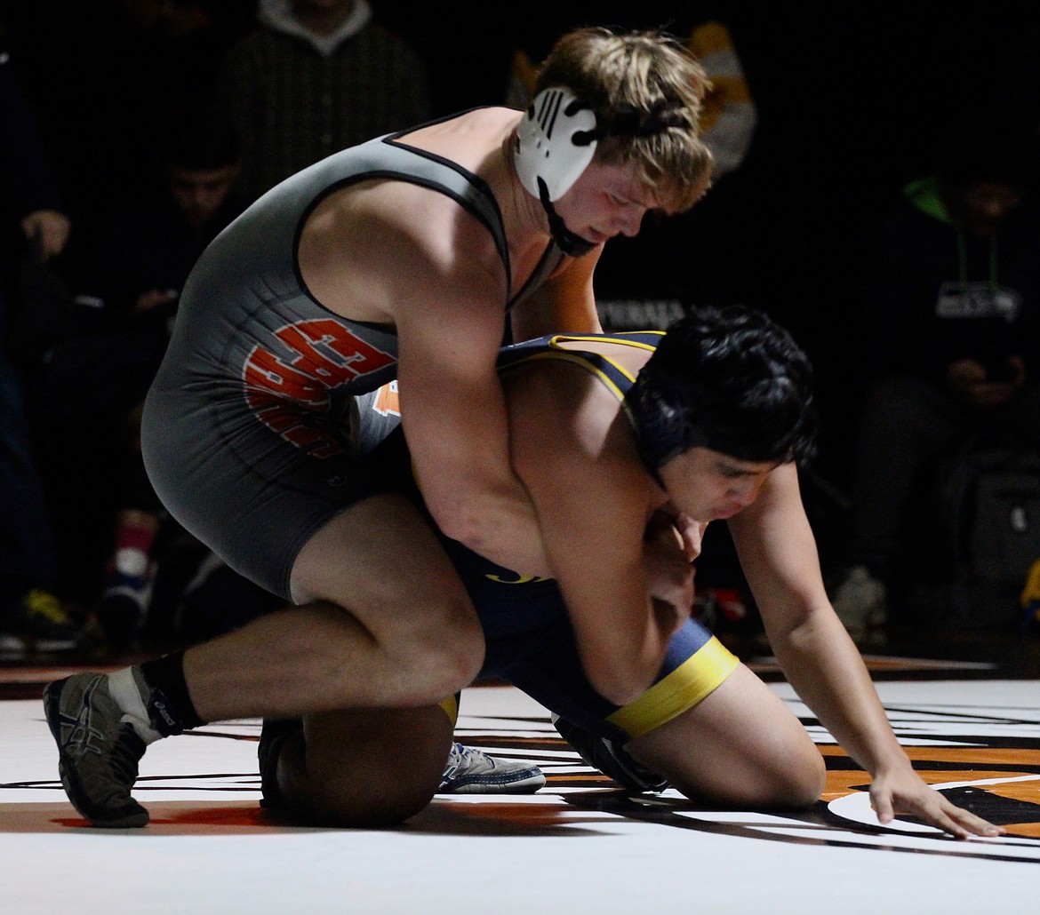 Casey McCarthy/Columbia Basin Herald Senior Mac Laird overpowers his opponent from Selah, picking up the win in the first round.