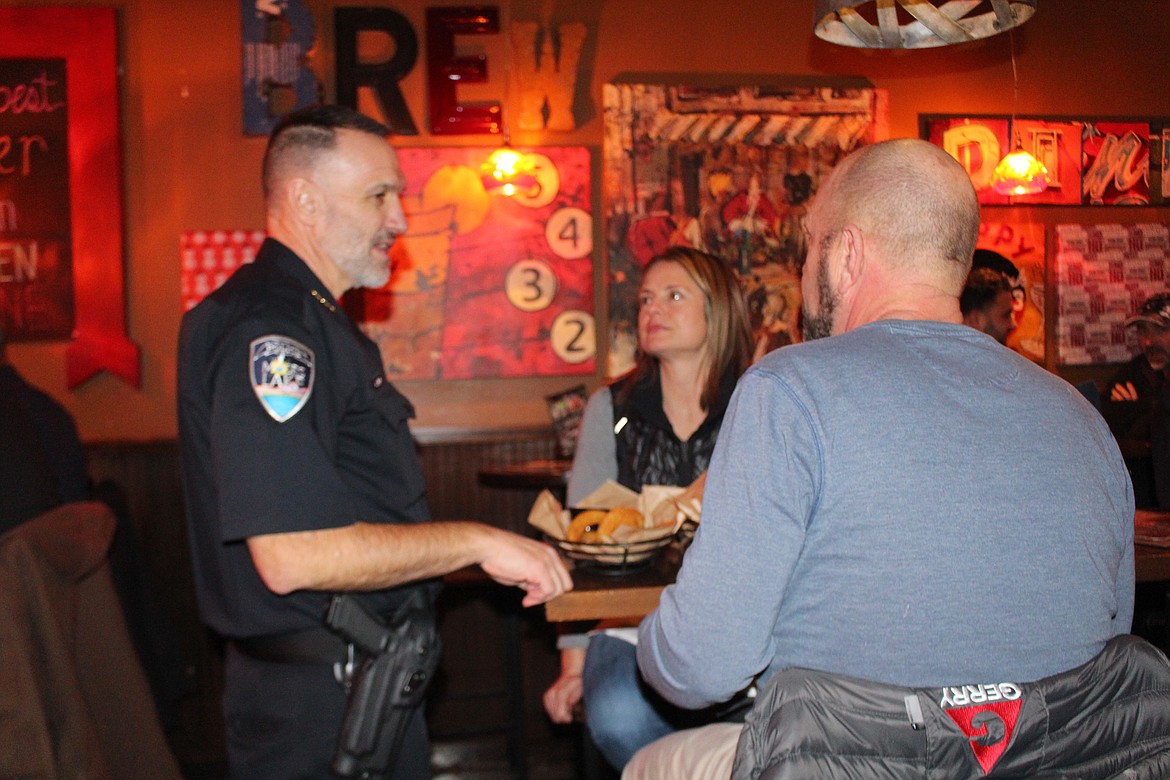 Moses Lake Police Chief Kevin Fuhr talks with customers during Tip A Cop night at the Rock Top restaurant Thursday, Money raised through Tip A Cop goes to the Shop with a Cop program.