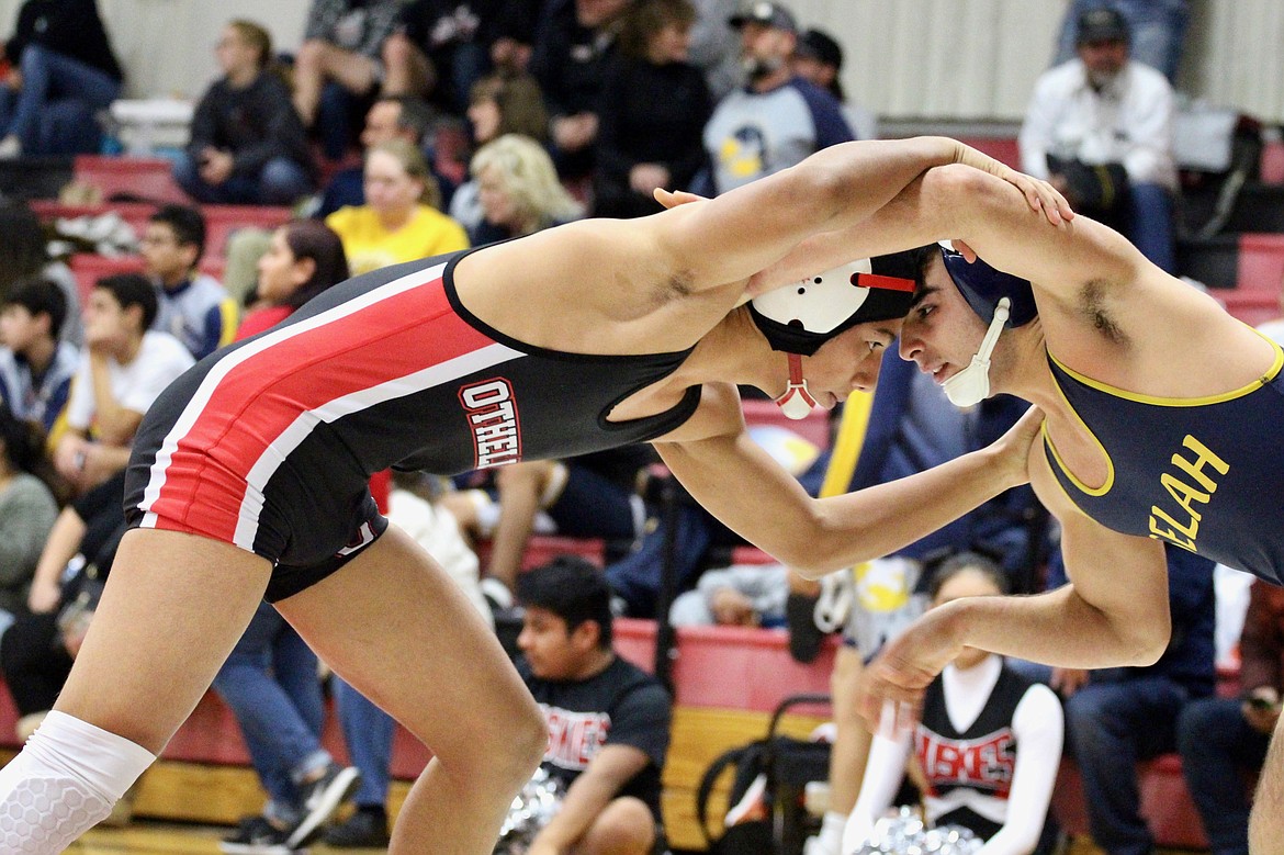 Casey McCarthy/Columbia Basin Herald Arturo Solorio stares through his opponent from Selah, as both fight for postion at the Leonard Schutte Roundup on Saturday at Othello High School.