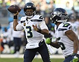 Wilson, Carson lift Seahawks past Panthers 30-24