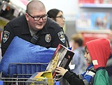 Local law enforcement agencies buy presents with needy children this week