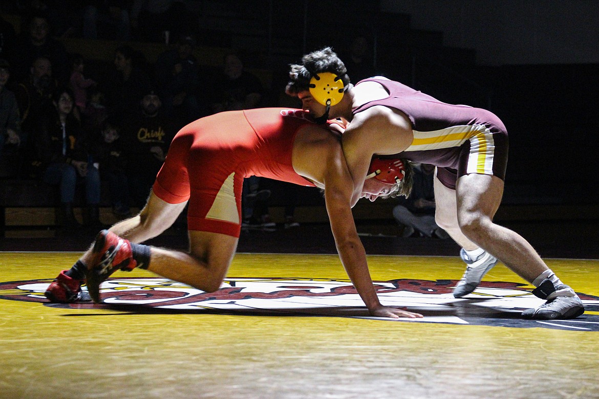 Moses Lake’s Everett Ashley, right, looks to maintain control of Eastmont’s Luke Harrison in their bout on Tuesday.
