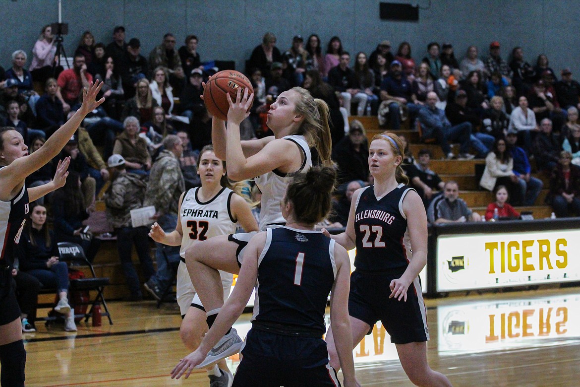 Casey McCarthy/Columbia Basin Herald Alanna Elliot goes up for the layup for the Tigers in the first half of Ephrata’s loss to Ellensburg on Friday.