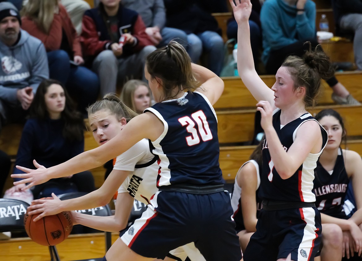 Ellensburg players trap the Ephrata player in the corner. The Bulldogs were able to continually force turnovers in their win over the Tigers on Friday.