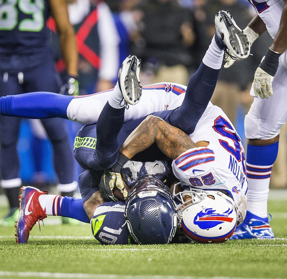 Seattle Seahawks receiver Paul Richardson and Buffalo Bills defender Robert Blanton both come down with the catch, but the call goes to Seattle in the fourth quarter on Monday, Nov. 7, 2016 at CenturyLink Field in Seattle, Wash. It was good for 15 yards, to the Buffalo 31 yard line. (Dean Rutz/Seattle Times/TNS)