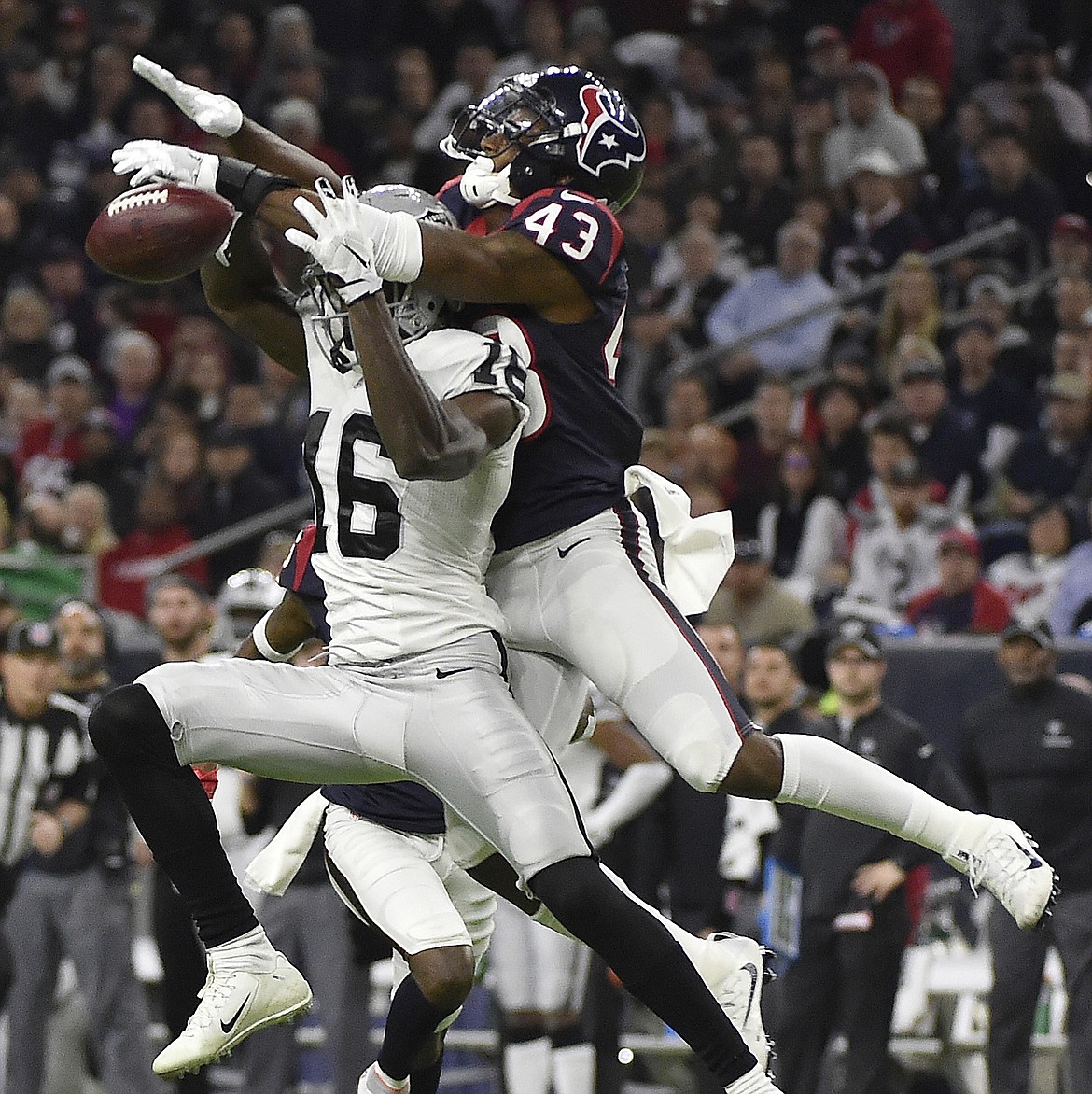 Houston Texans strong safety Corey Moore (43) breaks up a pass intended for Oakland Raiders wide receiver Johnny Holton (16) during the second half of an AFC Wild Card NFL game Saturday, Jan. 7, 2017, in Houston. (AP Photo/Eric Christian Smith)