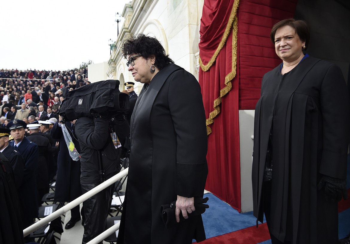 Supreme Court Justices Sonia Sotomayor, left, and Elena Kagan arrive on Capitol Hill in Washington, Friday, Jan. 20, 2017, for the presidential inauguration of Donald Trump. (Saul Loeb via AP, Pool)