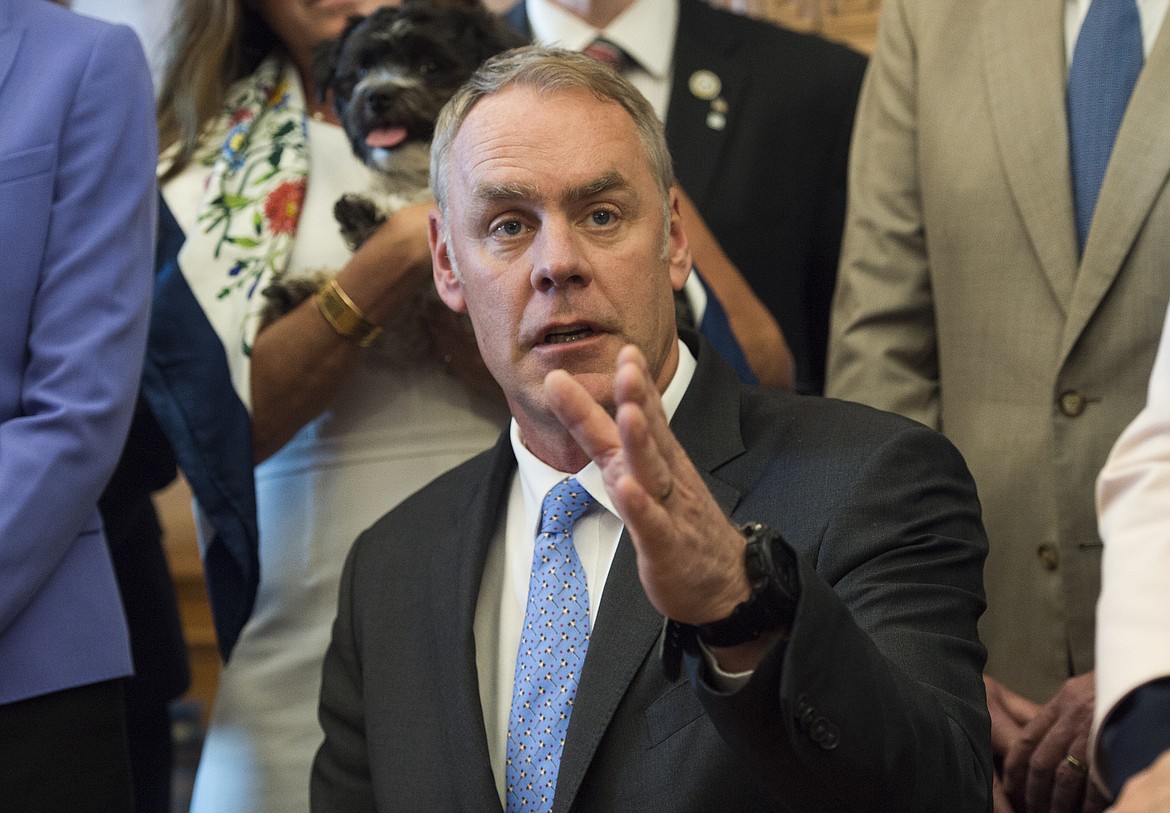 Interior Secretary Ryan Zinke speaks at the Interior Department in Washington, Wednesday, March 29, 2017, after signing an order lifting a moratorium on new coal leases on federal lands and a related order on coal royalties.  (AP Photo/Molly Riley)