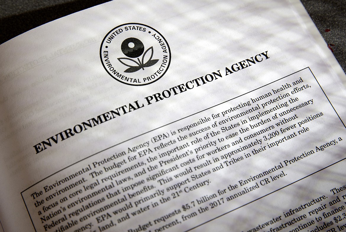 FILE - In this March 16, 2017, file photo, proposals for the Environmental Protection Agency (EPA) in President Donald Trump's first budget are displayed at the Government Printing Office in Washington. President Donald Trump will sign an executive order on March 29 that will suspend, rescind, or flag for review more than half-a-dozen measures that were part of former President Barack Obama&#146;s sweeping plan to curb global warming. (AP Photo/J. Scott Applewhite, file)