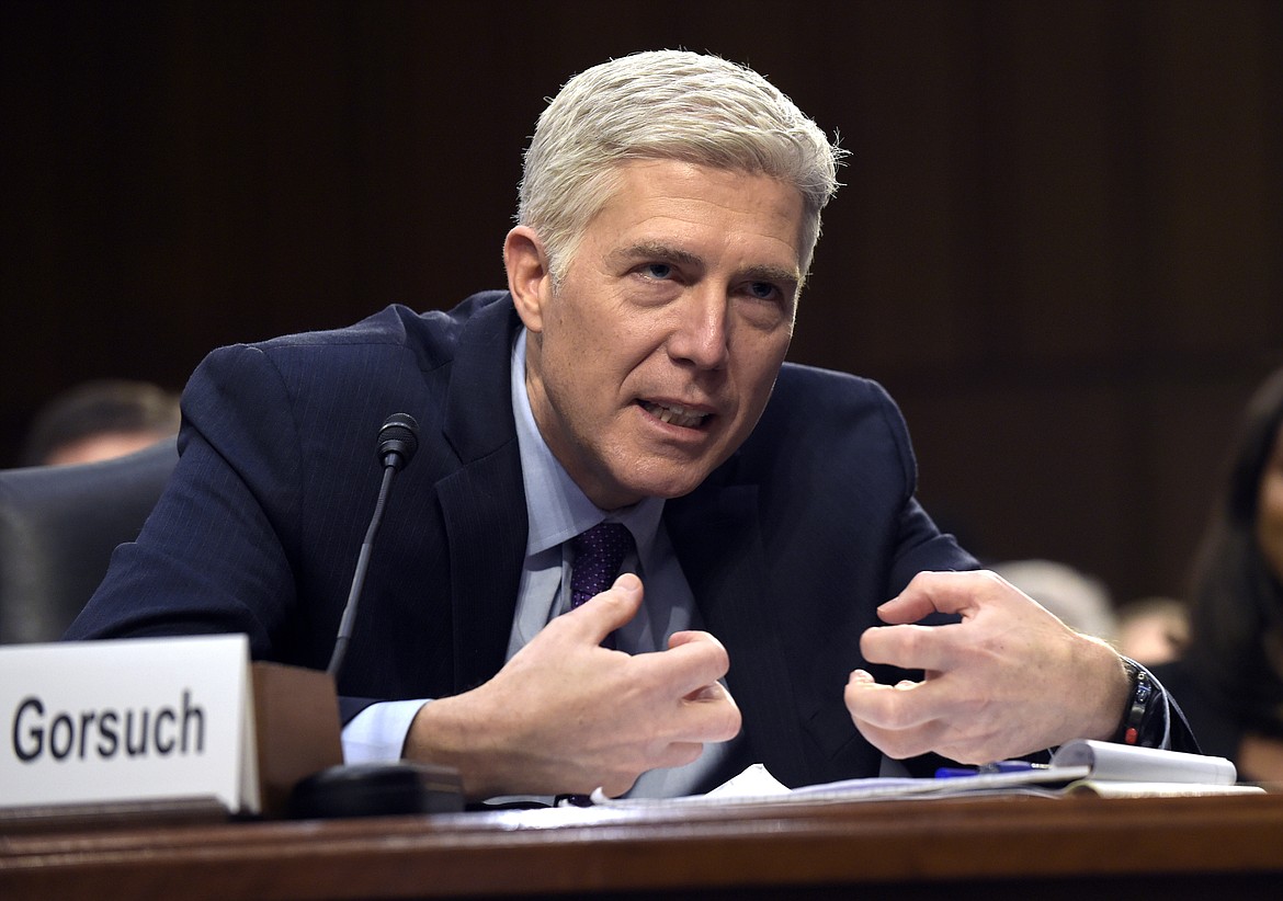 FILE - In this March 21, 2017, file photo, Supreme Court Justice nominee Judge Neil Gorsuch explains mutton busting, an event held at rodeos similar to bull riding or bronc riding, in which children ride or race sheep, as he testifies on Capitol Hill in Washington during his confirmation hearing before the Senate Judiciary Committee. A Senate showdown is at hand over President Donald Trump&#146;s Supreme Court nominee, and it could change the Senate and the court for years to come. (AP Photo/Susan Walsh, File)