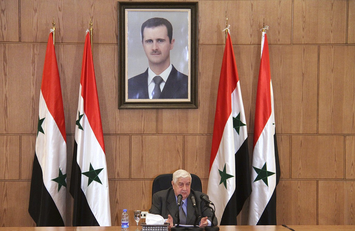In this photo released by the Syrian official news agency SANA, Syrian Foreign Minister Walid Moallem, speaks during a press conference, Thursday, April 6, 2017, in Damascus, Syria. Moallem told reporters Thursday that it didn&#146;t use chemical weapons in Tuesday&#146;s deadly chemical weapons attack in Syria&#146;s northern Idlib province, and he blamed the rebels for stockpiling the deadly substance. Moallem said any investigative mission would need to take off from Damascus and be far from the sphere of Turkish influence. (SANA via AP)