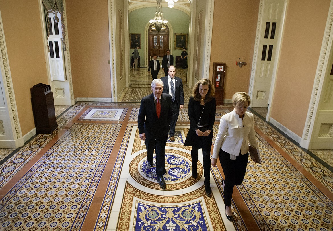 Senate Majority Leader Mitch McConnell of Ky. walks to his office on Capitol Hill in Washington, Thursday, April 6, 2017, after speaking on the floor about changes to the Senate rules to guarantee confirmation of Supreme Court nominee Neil Gorsuch. Republicans are poised to lower the threshold for a vote on Supreme Court nominees from 60 votes to a simple majority, eliminating the ability of Democrats to keep Gorsuch off the high court. (AP Photo/J. Scott Applewhite)