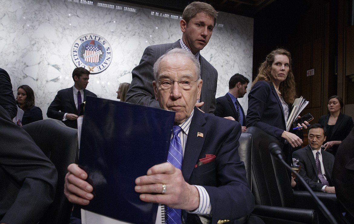 Senate Judiciary Committee Chairman Sen. Charles Grassley, R-Iowa, wraps up the meeting on Capitol Hill in Washington, Monday, April 3, 2017, after his panel voted along party lines on the nomination of President Donald Trump&#146;s Supreme Court nominee Neil Gorsuch. (AP Photo/J. Scott Applewhite)