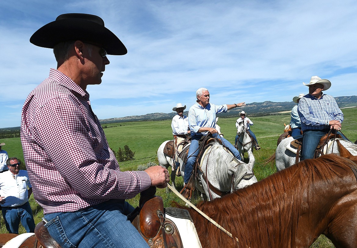 Vice President Mike Pence tours Westmoreland Coal Company's Absaloka Mine on the Crow Indian Reservation in Montana with Interior Secretary Ryan Zinke, left, and Crow Vice Chairman Carlson &quot;Duke&quot; Goes Ahead, right, Friday, May 12, 2017. Pence will headline an evening rally in support of Republican Greg Gianforte, who is seeking the state's only congressional seat. (Larry Mayer/The Billings Gazette via AP)