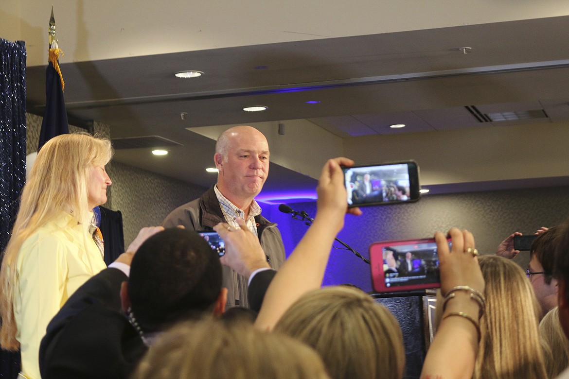 Republican Greg Gianforte greets supporters at a hotel ballroom after winning Montana&#146;s sole congressional seat, Thursday, May 25, 2017, in Bozeman, Mont. In his speech, Gianforte apologized for a altercation at his campaign headquarters with a reporter on the eve of the special election. The altercation led to a misdemeanor assault citation. (AP Photo/Bobby Caina Calvan)