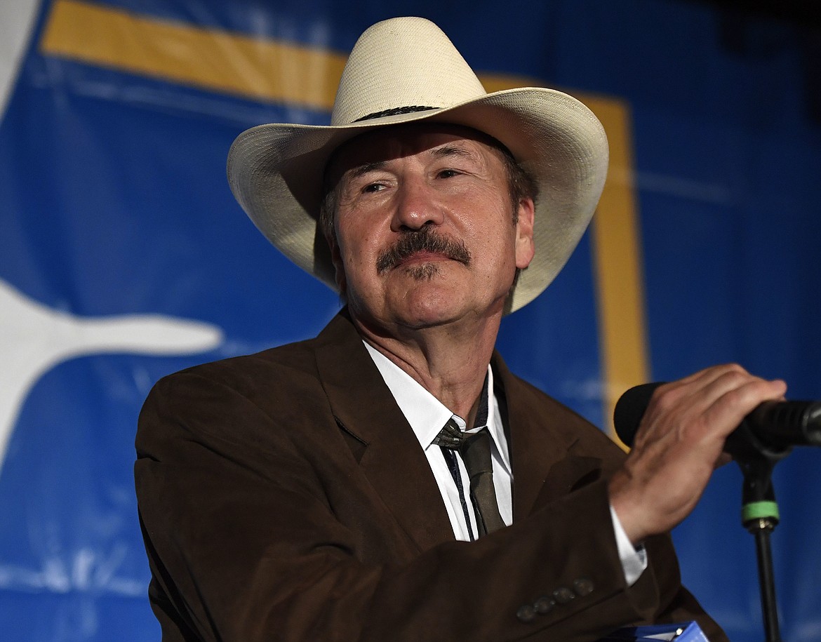 Democratic candidate Rob Quist holds the microphone as he begins his concession speech after losing to Republican candidate Greg Gianforte at the DoubleTree Hotel Thursday, May 25, 2017, in Missoula, Mont. Gianforte, a technology entrepreneur, defeated Quist to continue the GOP&#146;s two-decade stronghold on the congressional seat. Democrats had hoped Quist, a musician and first-time candidate, could have capitalized on a wave of activism following President Donald Trump&#146;s election. (Tommy Martino/The Missoulian via AP)