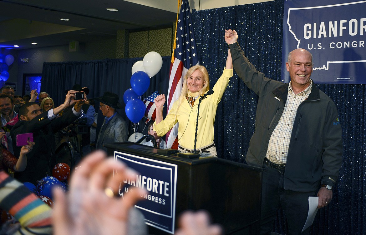 Greg Gianforte, right, and wife Susan, center, celebrate his win over Rob Quist for the open congressional seat at the Hilton Garden Inn Thursday night, May 25, 2017, in Bozeman, Mont. Gianforte, a technology entrepreneur, defeated Democrat Quist to continue the GOP&#146;s two-decade stronghold on the congressional seat.   (Rachel Leathe/Bozeman Daily Chronicle via AP)