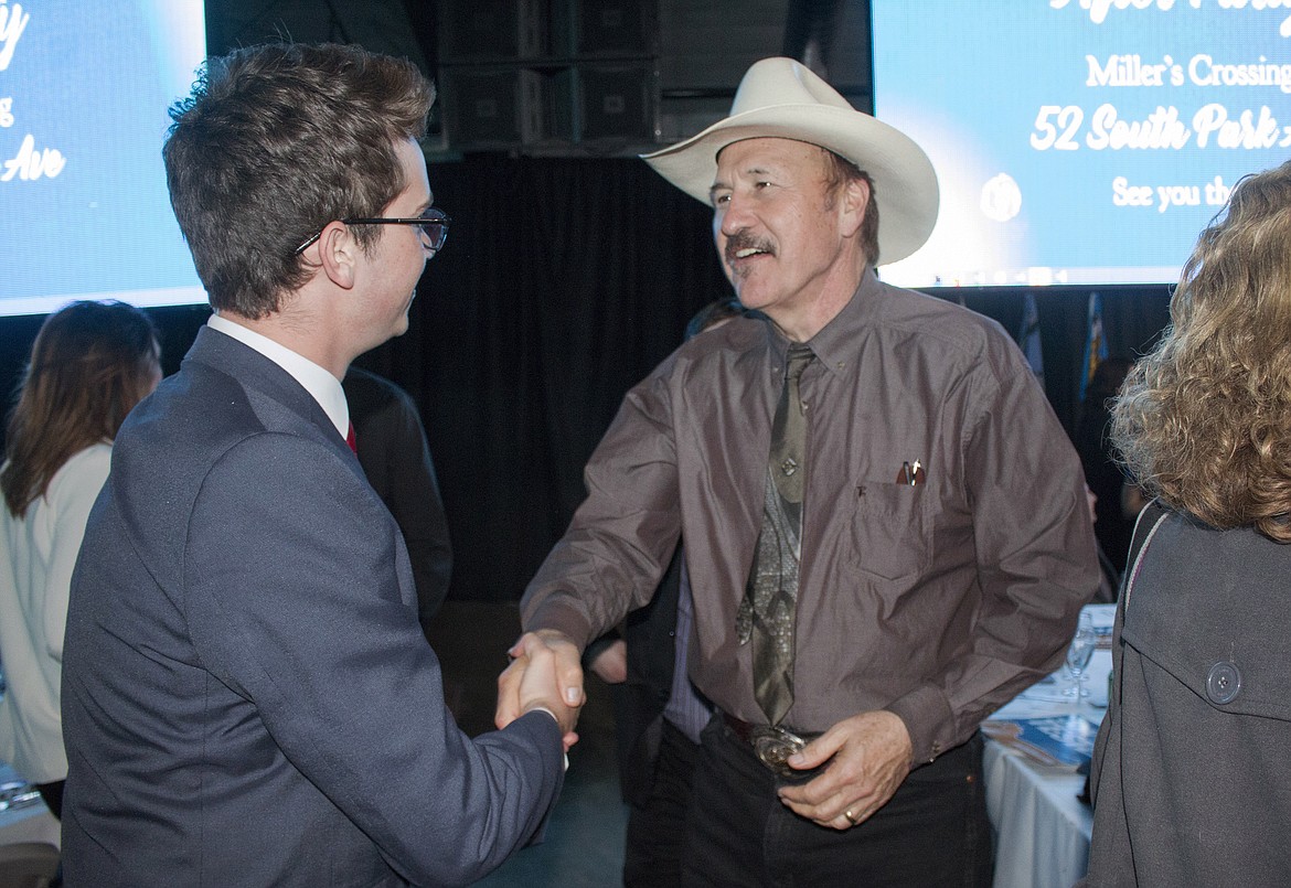 FILE - In this March 18, 2017 file photo, Congressional candidate Rob Quist meets with supporters during the annual Mansfield Metcalf Celebration dinner hosted by the state&#146;s Democratic Party in Helena, Mont. Montana voters are heading to the polls Thursday, May 25, 2017, to decide a nationally watched congressional election amid uncertainty in Washington over President Donald Trump&#146;s agenda and his handling of the country&#146;s affairs. (AP Photo/Bobby Caina Calvan, File)