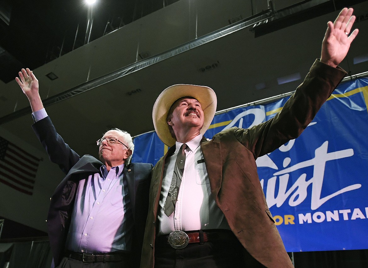 Sen. Bernie Sanders, left, and Rob Quist wave to the crowd after the conclusion of Sanders&#146; speech on Saturday, May 20, 2017, at the Adams Center on the University of Montana campus, in Missoula, Mont. (Tommy Martino /The Missoulian via AP)