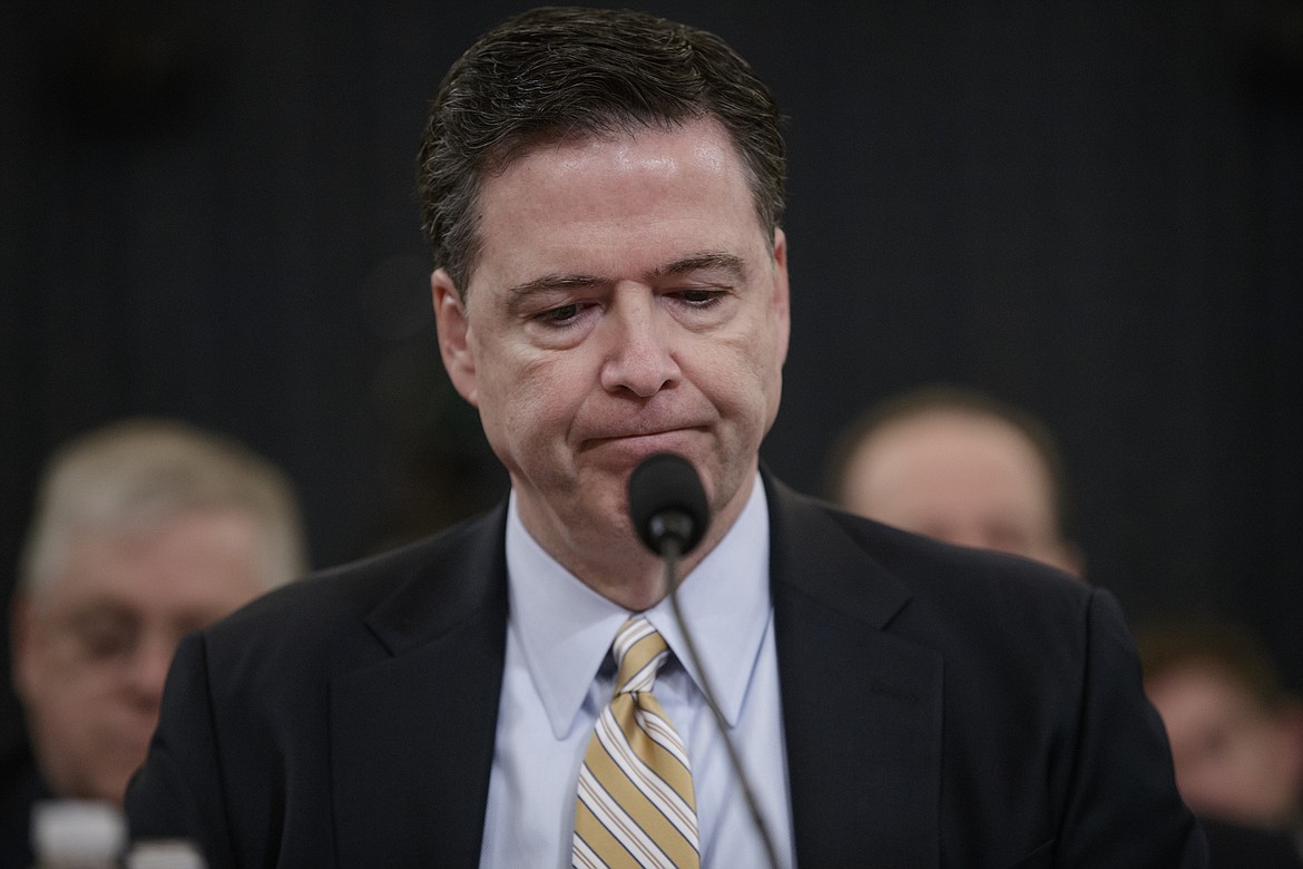 FILE - In this March 20, 2017, file photo, then-FBI Director James Comey pauses as he testifies on Capitol Hill in Washington, before the House Intelligence Committee hearing on allegations of Russian interference in the 2016 U.S. presidential election. Comey will testify that President Donald Trump sought his &#147;loyalty&#148; and asked what could be done to &#147;lift the cloud&#148; of investigation shadowing his White House, according to prepared remarks released ahead of his appearance on Capitol Hill on June 8, 2017.(AP Photo/J. Scott Applewhite, File)