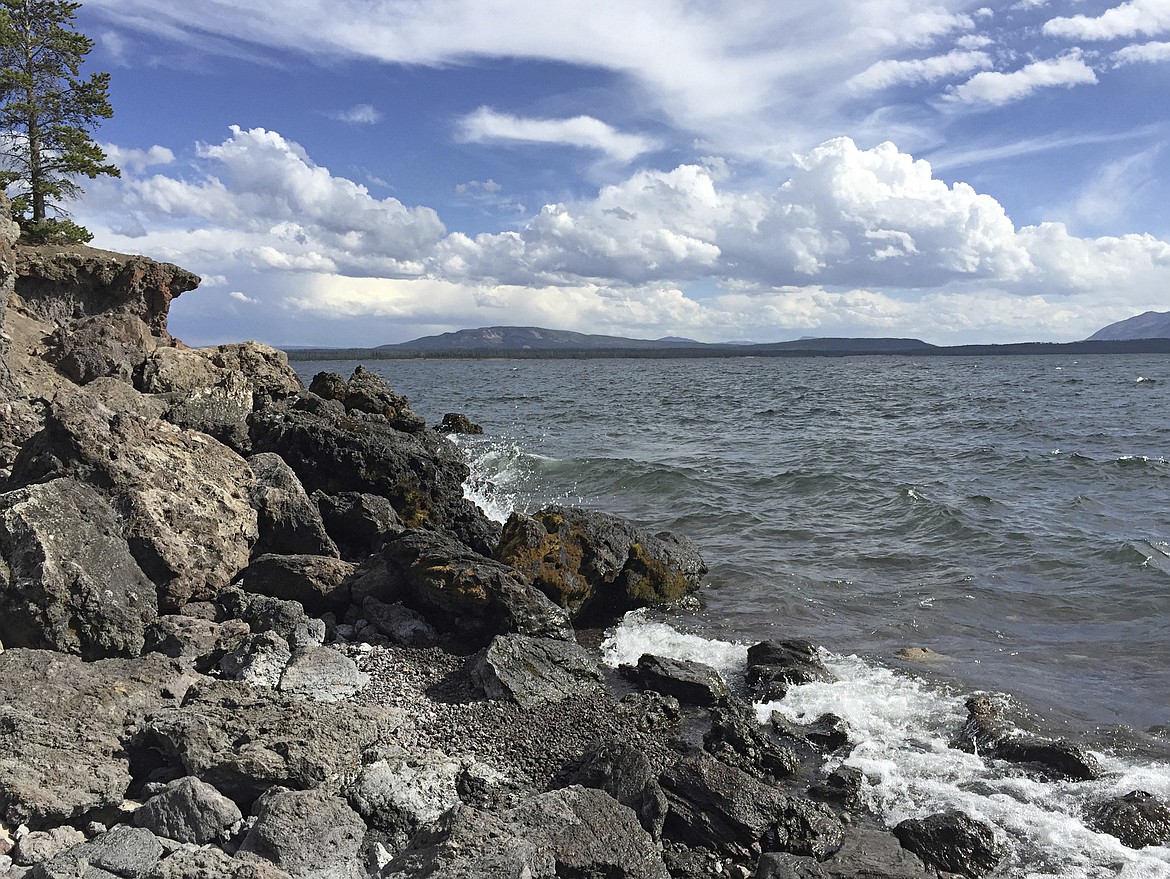 This Sept. 3, 2015, photo provided by the Yellowstone National Park Service, shows the West Thumb area of Yellowstone Lake in Mammoth Hot Springs, Wyo. A 23-year-old kayak guide, Timothy Hayden Ryan Conant of Salt Lake City, died while trying to rescue a client who capsized in the West Thumb area of Yellowstone Lake Wednesday, June 14, 2017. (Jim Peaco/Yellowstone National Park Service via AP)