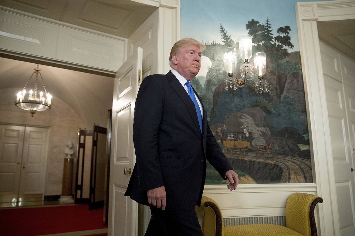 President Donald Trump arrives in the Diplomatic Room of the White House in Washington, Wednesday, June 14, 2017, to talk about the shooting in Alexandria, Va. where House Majority Whip Steve Scalise of La., and others, where shot during a Congressional baseball practice. (AP Photo/Andrew Harnik)