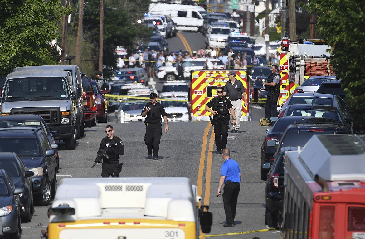 Emergency personnel respond after reports of shots fired Wednesday June 14, 2017 in Alexandria, Va.   A top House Republican, Steve Scalise of Louisiana, was shot by a rifle-wielding gunman early Wednesday at a congressional baseball practice just outside of Washington. Several other people were also wounded, officials said.  (Matt McClain/The Washington Post via AP)