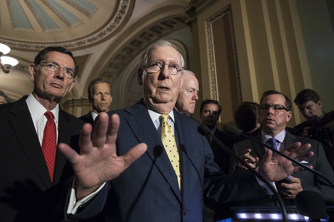 Senate Majority Leader Mitch McConnell, R-Ky., joined by, from left, Sen. John Barrasso, R-Wyo., Sen. John Thune, R-S.D., and Majority Whip John Cornyn, R-Texas, speaks following a closed-door strategy session, at the Capitol in Washington, Tuesday, June 20, 2017. Sen. McConnell says Republicans will have a &quot;discussion draft&quot; of a GOP-only bill scuttling former President Barack Obama's health care law by Thursday. (AP Photo/J. Scott Applewhite)