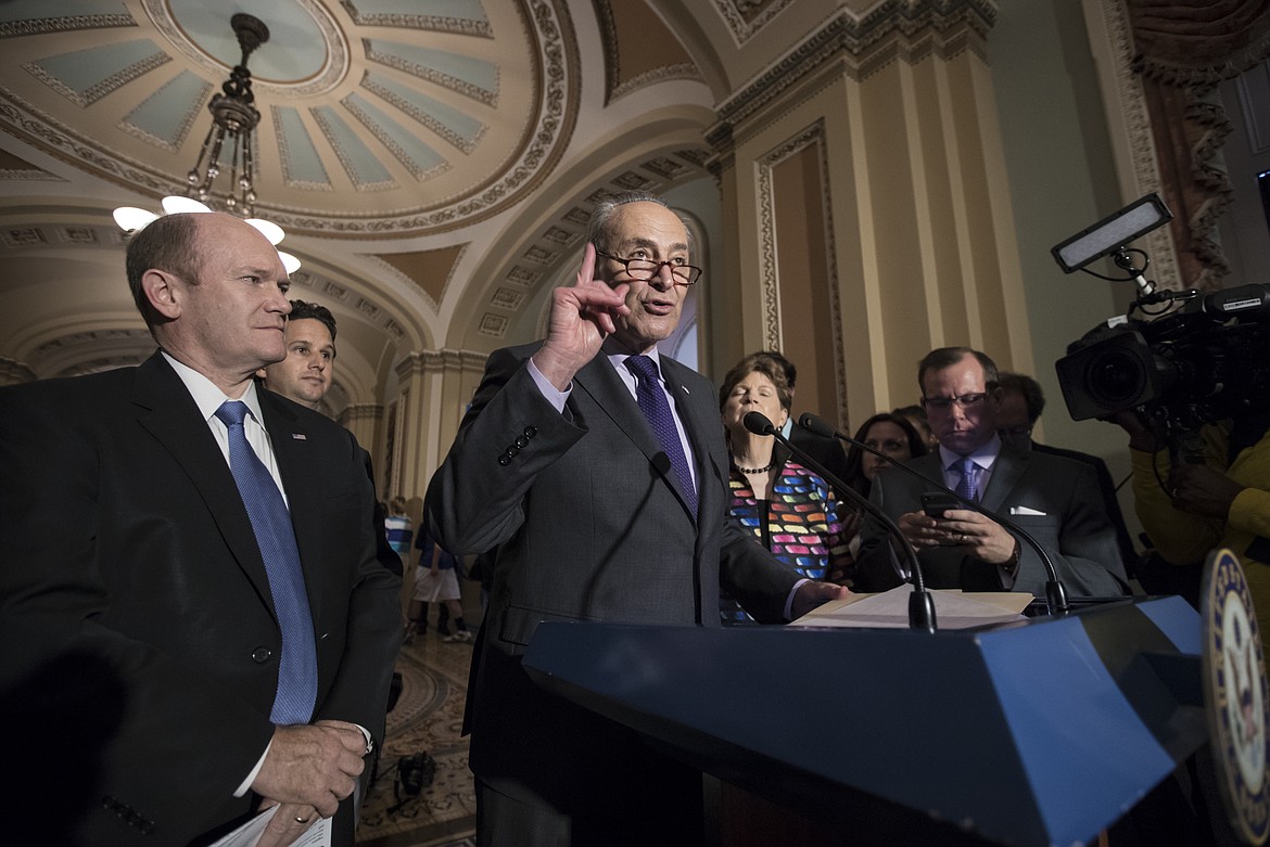 Senate Minority Leader Chuck Schumer, D-N.Y., joined by, from left, Sen. Chris Coons, D-Del., Sen. Brian Schatz, D-Hawaii, and Sen. Jeanne Shaheen, D-N.H., speaks about the health overhaul following a closed-door strategy session at the Capitol in Washington, Tuesday, June 20, 2017. Senate Majority Leader Mitch McConnell says Republicans will have a &quot;discussion draft&quot; of a GOP-only bill scuttling former President Barack Obama's health care law by Thursday. (AP Photo/J. Scott Applewhite)