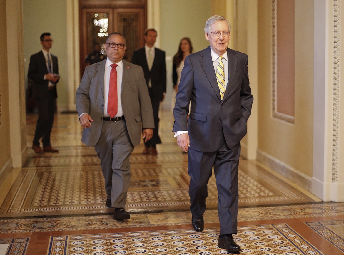 Senate Majority Leader Mitch McConnell of Ky. walks to his office on Capitol Hill in Washington Thursday, July 13, 2017. McConnell is planning on rolling out the GOP's revised health care bill, pushing toward a showdown vote next week with opposition within the Republican ranks. (AP Photo/Pablo Martinez Monsivais)