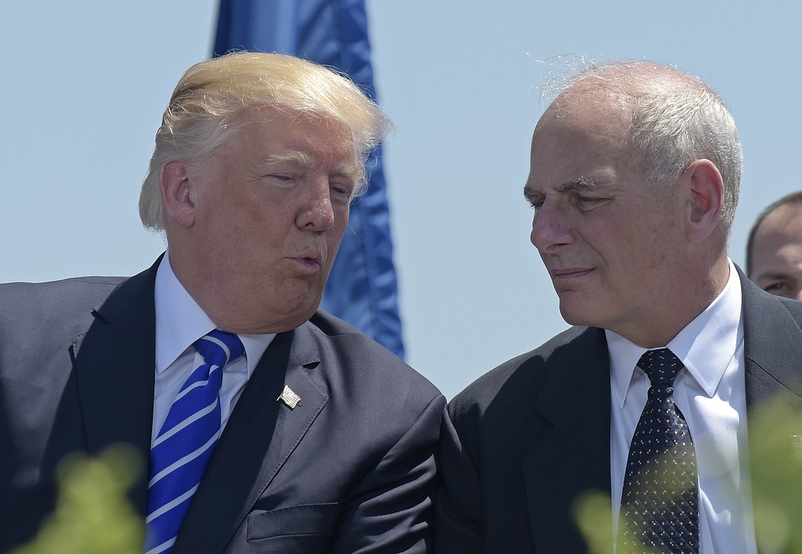 FILE - In this May 17, 2017, file photo, President Donald Trump talks with Homeland Security Secretary John Kelly during commencement exercises at the U.S. Coast Guard Academy in New London, Conn. Trump named Kelly as his new Chief of Staff on July 28, ousting Reince Priebus. (AP Photo/Susan Walsh)