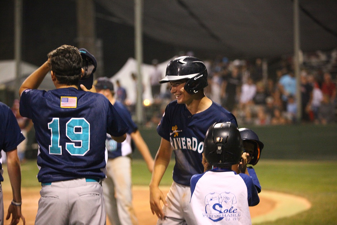 Rodney Harwood/Columbia Basin Herald
Ethan Etter is all smiles after scoring the winning run in the eighth inning of Wednesday night&#146;s win over Mt. Olive, N.J.