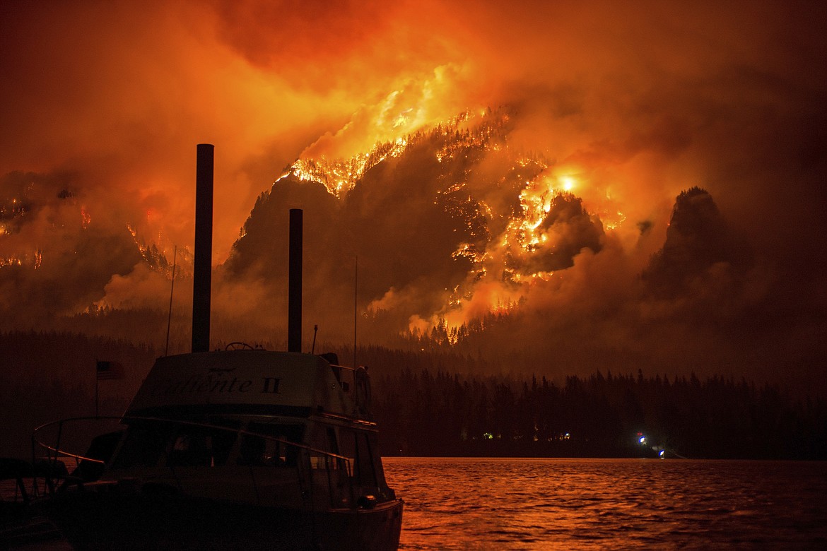 This Monday Sept. 4, 2017, photo provided by KATU-TV shows the Eagle Creek wildfire as seen from Stevenson Wash., across the Columbia River, burning in the Columbia River Gorge above Cascade Locks, Ore. A lengthy stretch of highway Interstate 84 remains closed Tuesday, Sept. 5, as crews battle the wildfire that has also caused evacuations and sparked blazes across the Columbia River in Washington state. (Tristan Fortsch/KATU-TV via AP)