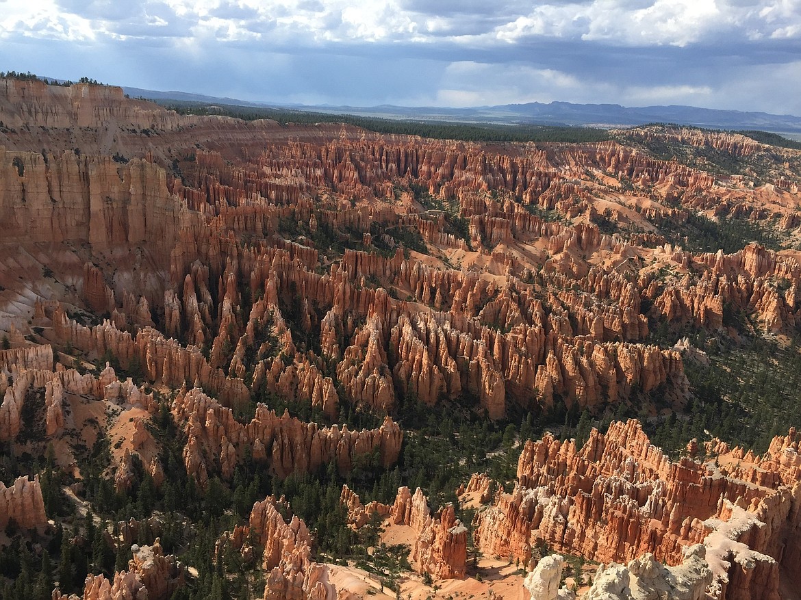 FILE - This May 25, 2017 file photo shows a view of the world-famous hoodoos, also called tent rocks, fairy chimneys and earth pyramids, at Inspiration Point in Bryce Canyon National Park in Utah. Hawaii residents and an organization representing federal workers filed a lawsuit against the Federal Aviation Administration on Wednesday, Oct. 4, 2017 seeking to force it to do something about tour helicopters buzzing around seven national parks across the country.  (AP Photo/Eva Parziale, File)