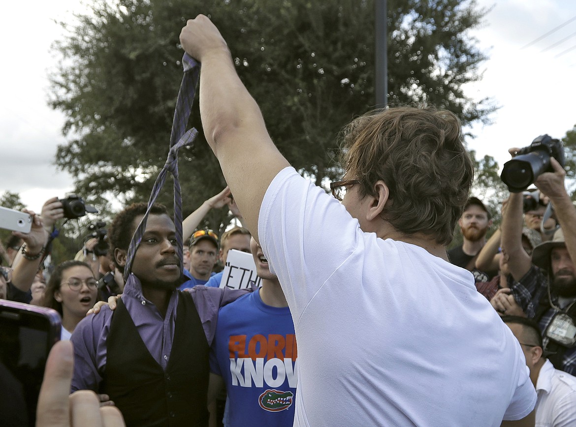 A supporter of white nationalist Richard Spencer grabs ahold of a protester&#146;s tie during a clash after a speech by Spencer, Thursday, Oct. 19, 2017, at the University of Florida in Gainesville, Fla. (AP Photo/Chris O&#146;Meara)