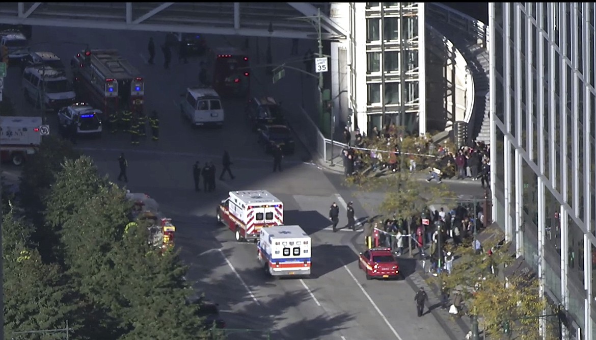 In this still image taken from video, police and ambulances respond to report of gunfire a few blocks from the World Trade Center in New York on Tuesday, Oct. 31, 2017. (AP Photo)