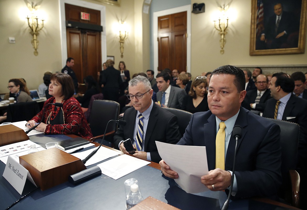 Natalie Jaresko, executive director, and Noel Zamot, revitalization coordinator, both of the financial oversight and management board for Puerto Rico, and Guaynabo Mayor Angel P&eacute;rez Otero, wait for the start of a House Committee on Natural Resources hearing to examine challenges in Puerto Rico's recovery and the role of the financial oversight and management board, on Capitol Hill, Tuesday, Nov. 7, 2017 in Washington. (AP Photo/Alex Brandon)