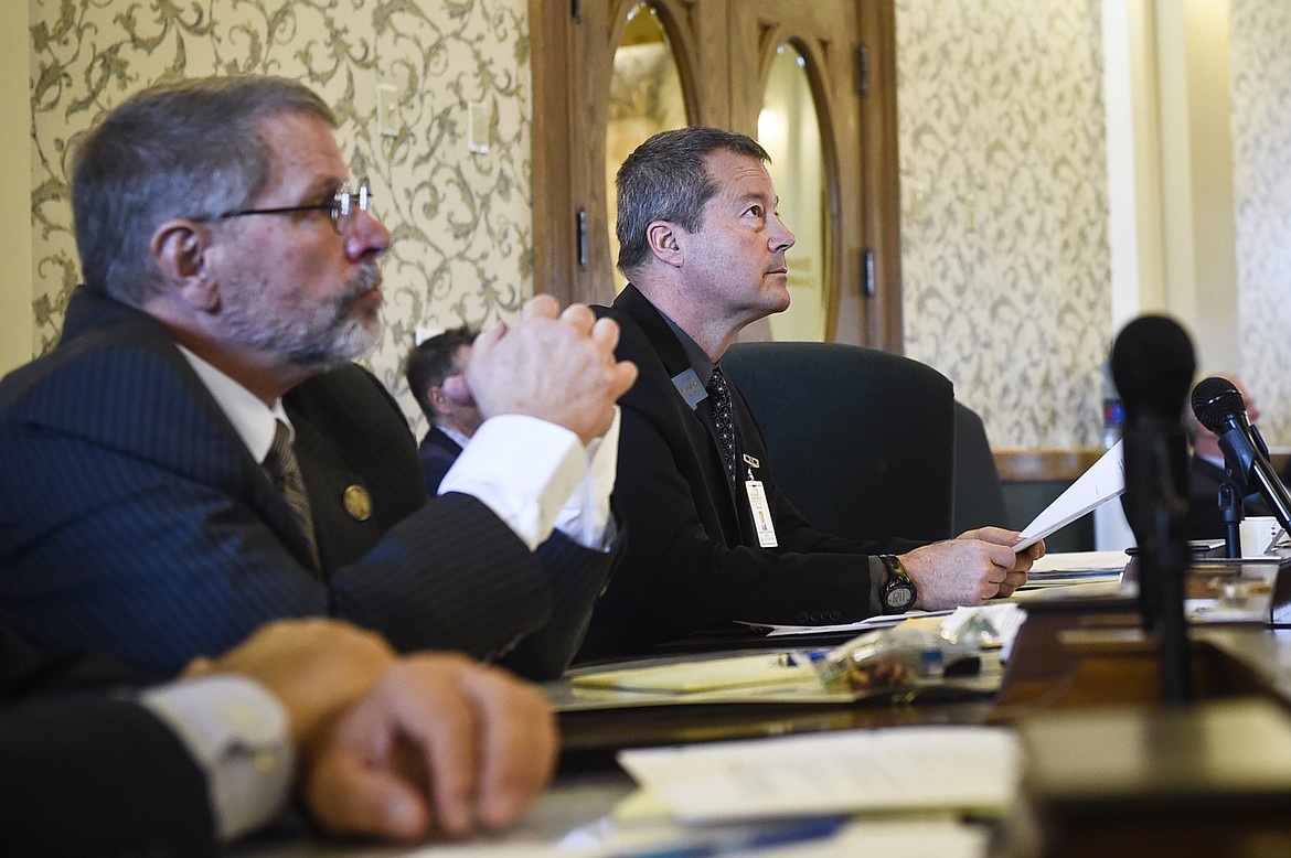 Sen. Albert Olszewski (R- Kalispell), center, proposed Tuesday, Nov. 14, 2017, to halt a change made by the Department of Public Health and Human Services to use the word &#147;gender&#148; instead of &#147;sex&#148; on birth certificates, saying it would cost extra money, in Helena, Mont.  (Thom Bridge/Independent Record via AP)