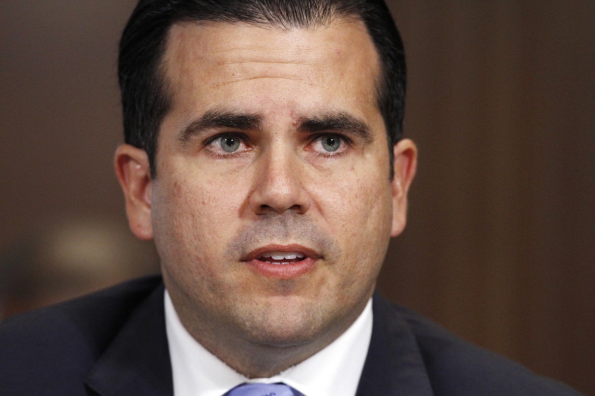 Puerto Rico Gov. Ricardo Rossello, left, speaks during a Senate Committee on Energy and Natural Resources hearing on hurricane recovery, Tuesday, Nov. 14, 2017, on Capitol Hill in Washington. (AP Photo/Jacquelyn Martin)