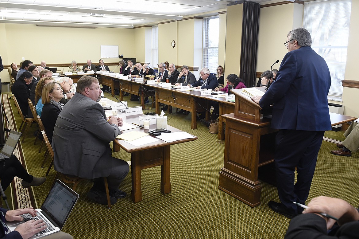 Kevin Braun, general counsel for Montana State Fund, right, testifies before the joint meeting of the House Business and Labor and Senate Business, Labor, and Economic Affairs committees Monday, Nov. 13, 2017, during the first day of the special legislative session in Helena.  (Thom Bridge/Independent Record via AP)