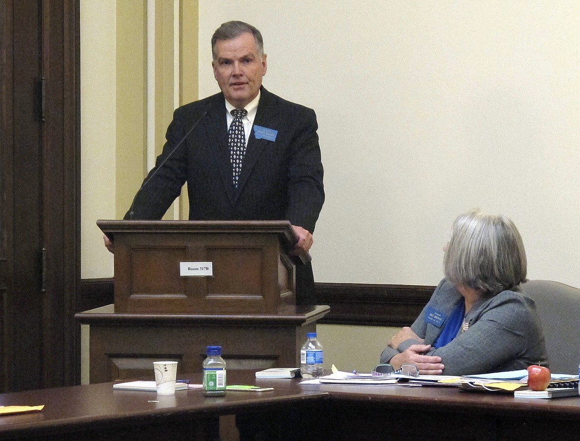 FILE - In this Nov. 14, 2016 file photo, Montana state Sen. Scott Sales addresses members of the Republican caucus after being elected Senate president Monday, Nov. 14, 2016, in Helena, Mont. He and other lawmakers are returning to the Capitol on Monday, Nov. 13, 2017, to address a projected $227 million budget deficit. The Republican from Bozeman said he would like to avoid raising taxes to balance the budget, with the apparent exception of two nonprofit health insurance companies. (AP Photo/Matt Volz, File)