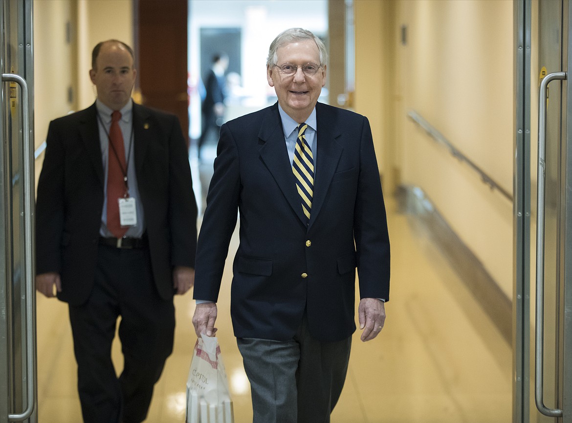 Senate Majority Leader Mitch McConnell, R-Ky., walks through the Capitol as lawmakers return to work after their Thanksgiving break to face unfinished business on taxes and spending, in Washington, Monday, Nov. 27, 2017. (AP Photo/J. Scott Applewhite)