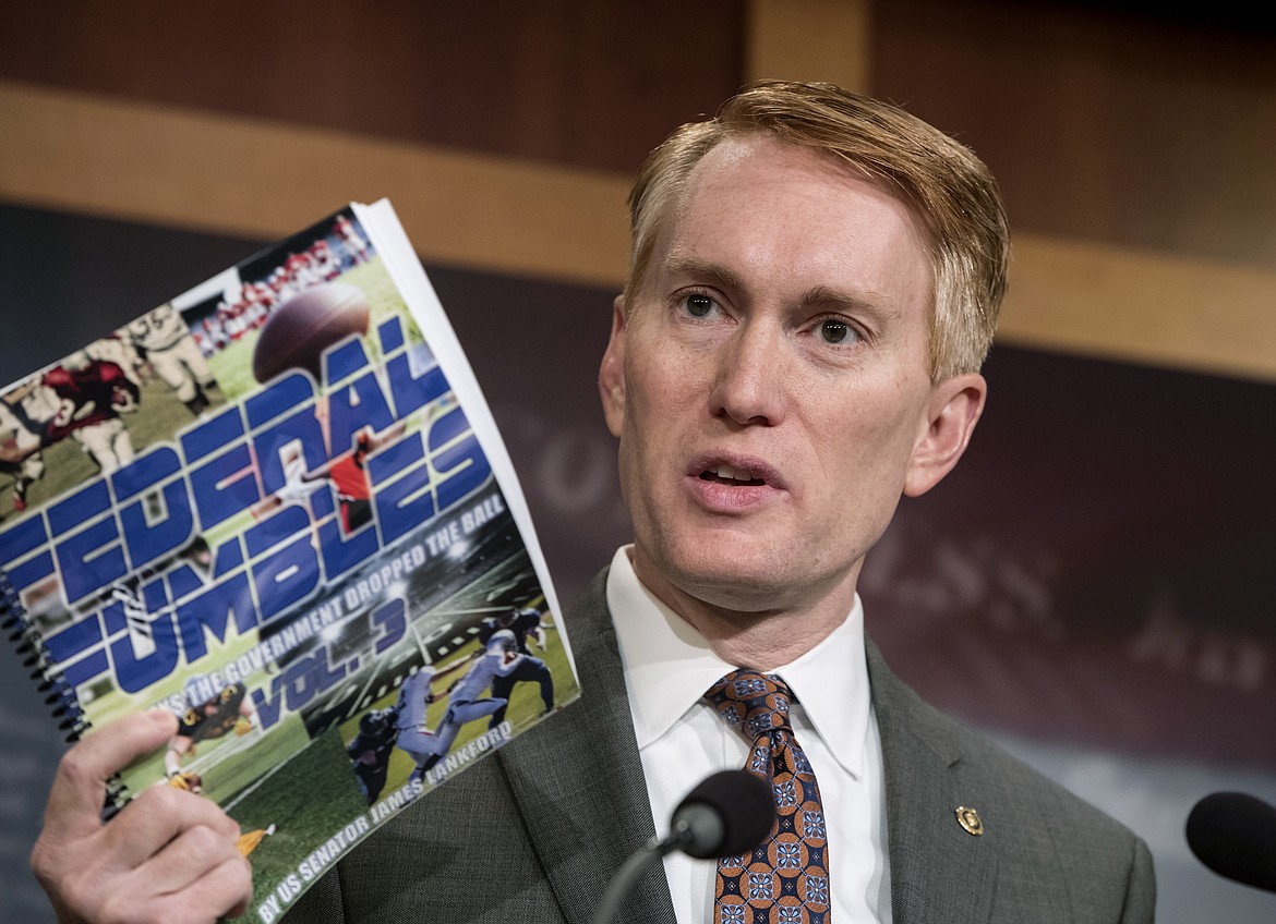 Sen. James Lankford, R-Okla., a member of the Senate Appropriations Committee, holds a news conference to outline the release of his report on wasteful spending in the federal government, on Capitol Hill in Washington, Monday, Nov. 27, 2017. (AP Photo/J. Scott Applewhite)