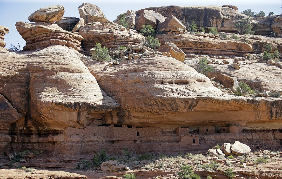 FILE - This July 15, 2016, file photo, shows the &#147;Moonhouse&#148; in McLoyd Canyon which is part of Bears Ears National Monument, near Blanding, Utah. President Donald Trump&#146;s rare move to shrink two large national monuments in Utah triggered another round of outrage among Native American leaders who vowed to unite and take the fight to court to preserve protections for lands they consider sacred. Trump decided to reduce Bears Ears &#151; created last December by President Barack Obama &#151; by about 85 percent and Grand Staircase-Escalante &#151; designated in 1996 by President Bill Clinton &#151; by nearly half. (AP Photo/Rick Bowmer, File)