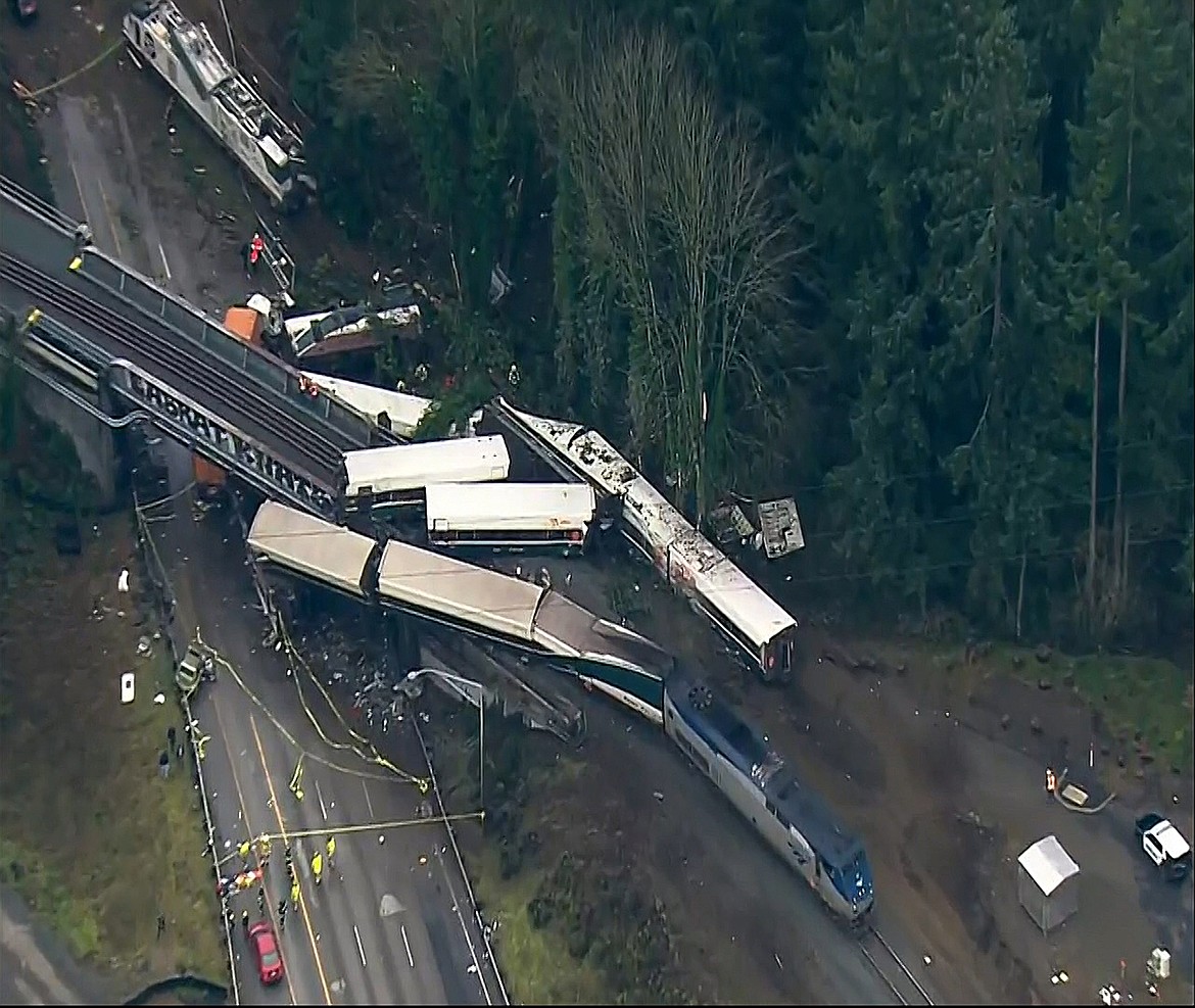 This aerial image from video provided by KOMO-TV, shows the site of an Amtrak train that derailed south of Seattle on Monday, Dec. 18, 2017. Authorities reported &#147;injuries and casualties.&#148; The train derailed about 40 miles (64 kilometers) south of Seattle before 8 a.m., spilling at least one train car on to busy Interstate 5. (KOMO-TV via AP) TV OUT MANDATORY CREDIT